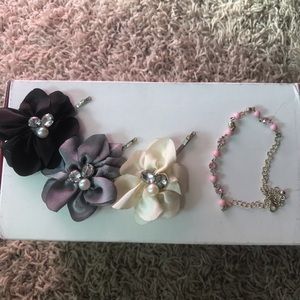 3 flower clips and a pink dainty bracelet